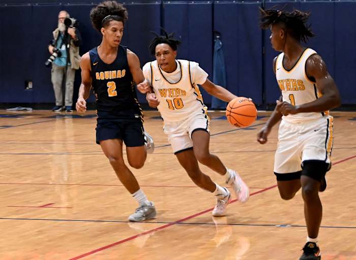 Winter Haven guard Eric Dailey drives the ball up floor against St. Thomas Aquinas on Saturday at the Kingdom in the Sun Tournament at Vanguard High School in Ocala.
